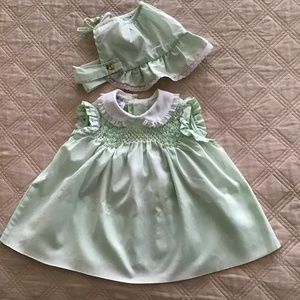 Polly Flinders hand smocked dress with matching bonnet.